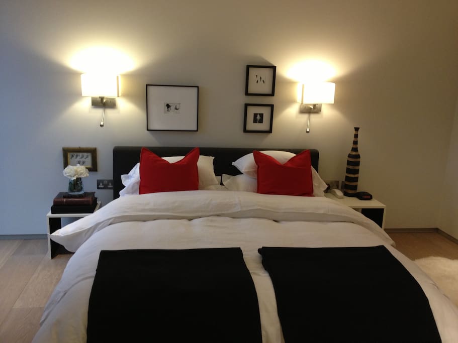 King bed with luxury bedding.