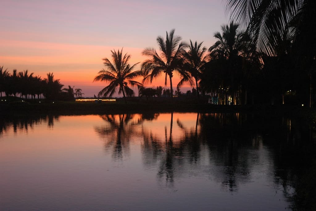 Take in a vibrant sunset over the water.
