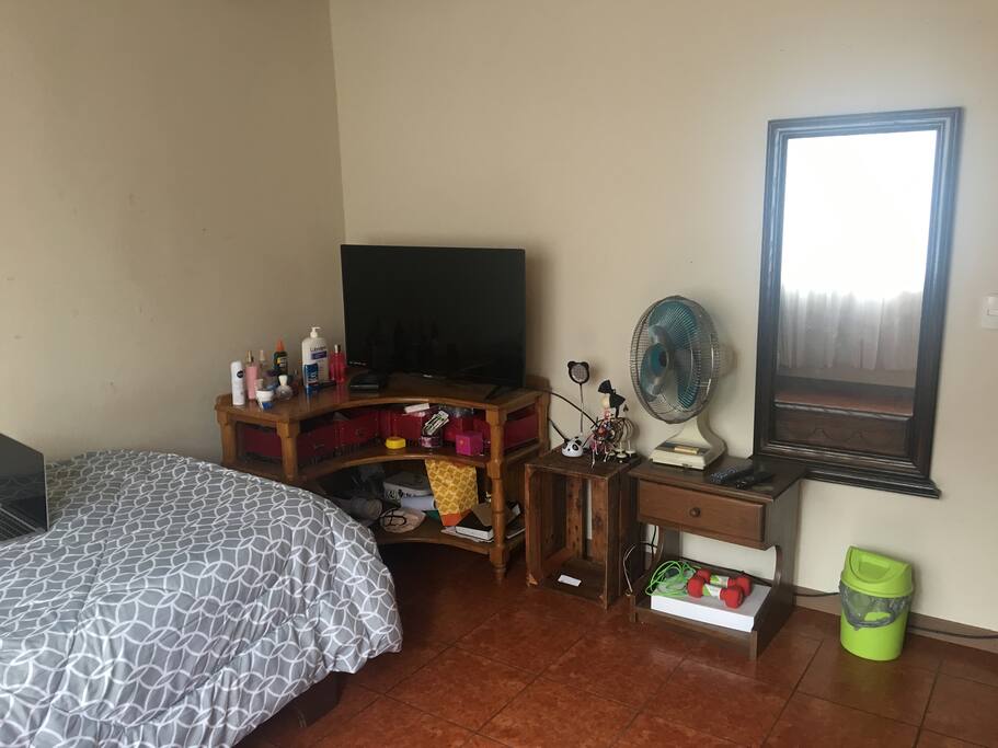 Private room with individual bed, closet, furniture and smart tv with cable