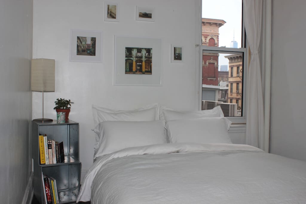 Your bedroom:
Quiet and sun-drenched. Comfy, new queen bed with plush mattress. View of the Freedom tower.