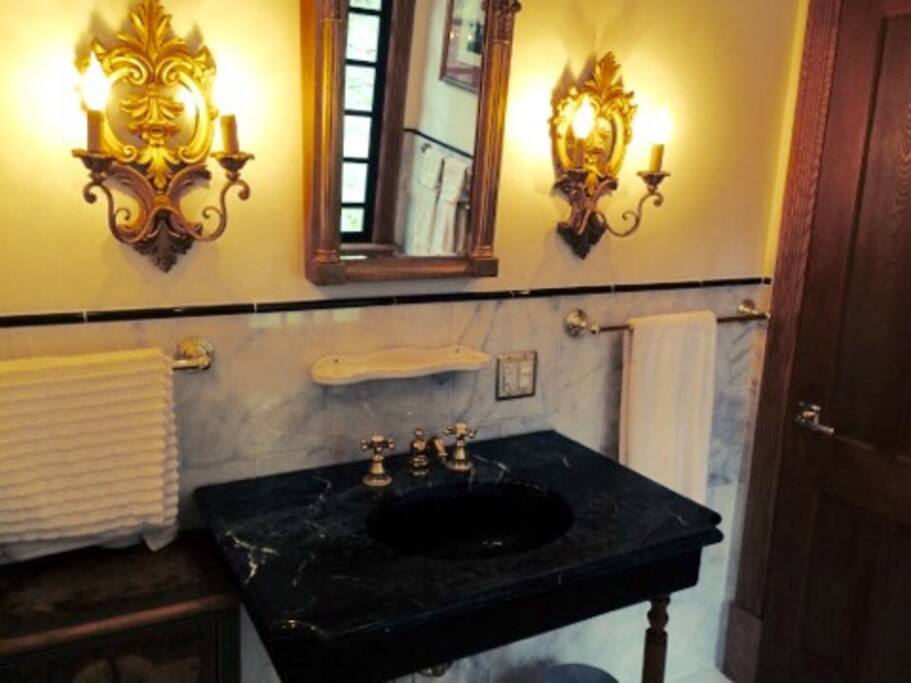 Marble bathroom with tub and shower