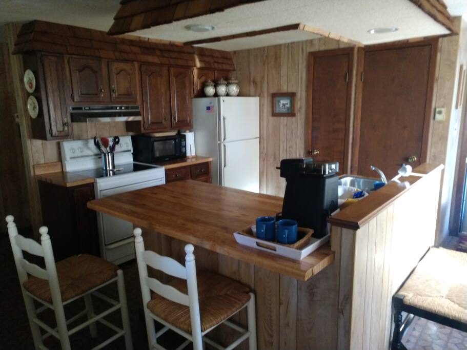The full kitchen is stocked with the basics and more to make enjoying a meal in nice and easy.