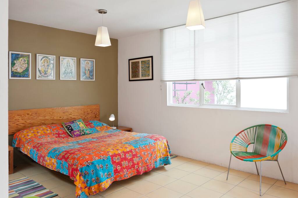 window looks out on balcony and orange trees.