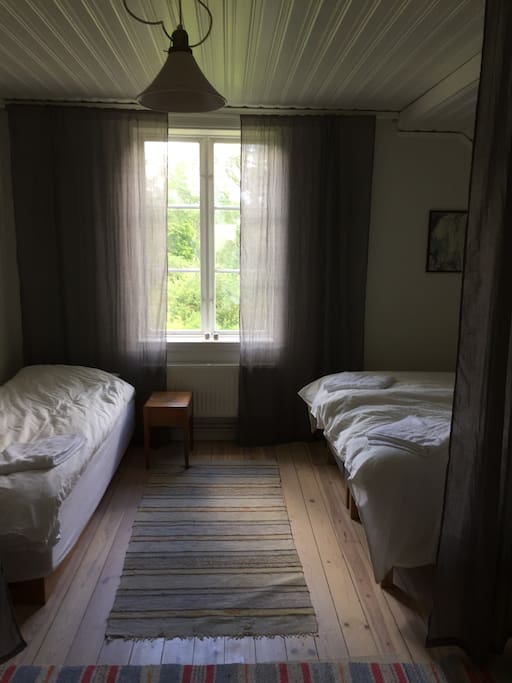 Bedroom upstairs with 3 beds