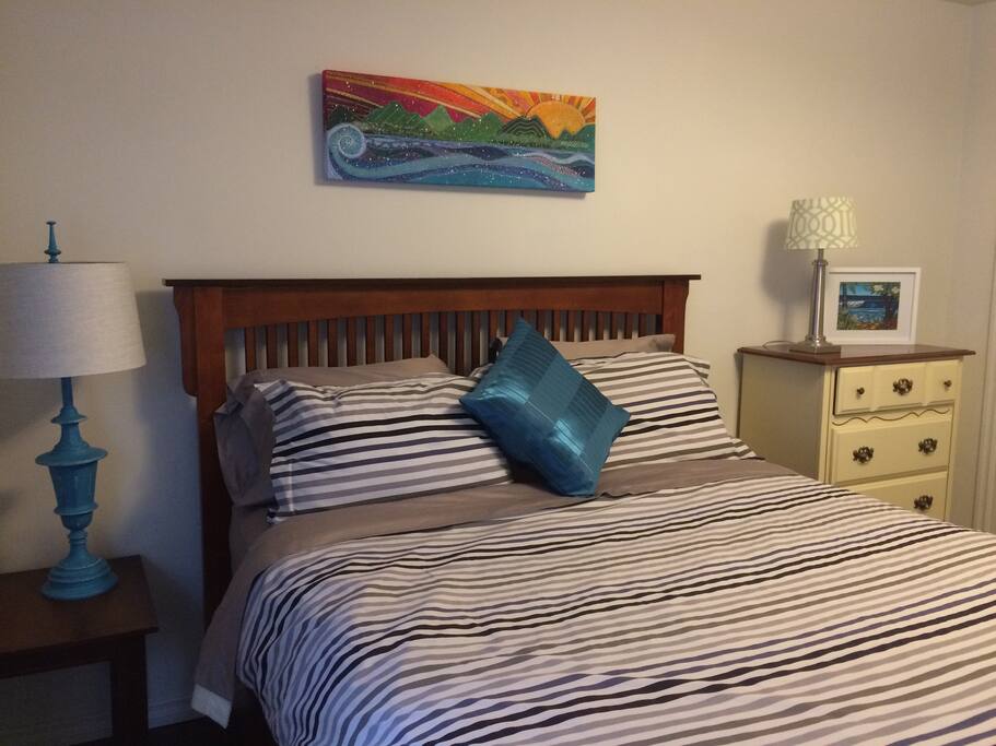 A comfortable queen bedroom, with plenty of storage space.