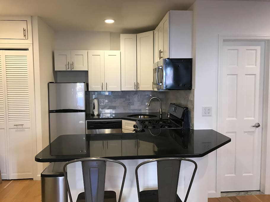 Renovated kitchen with dishwasher and microwave