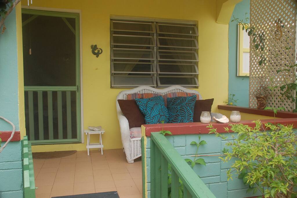 Kick back on the veranda overlooking the tropical garden