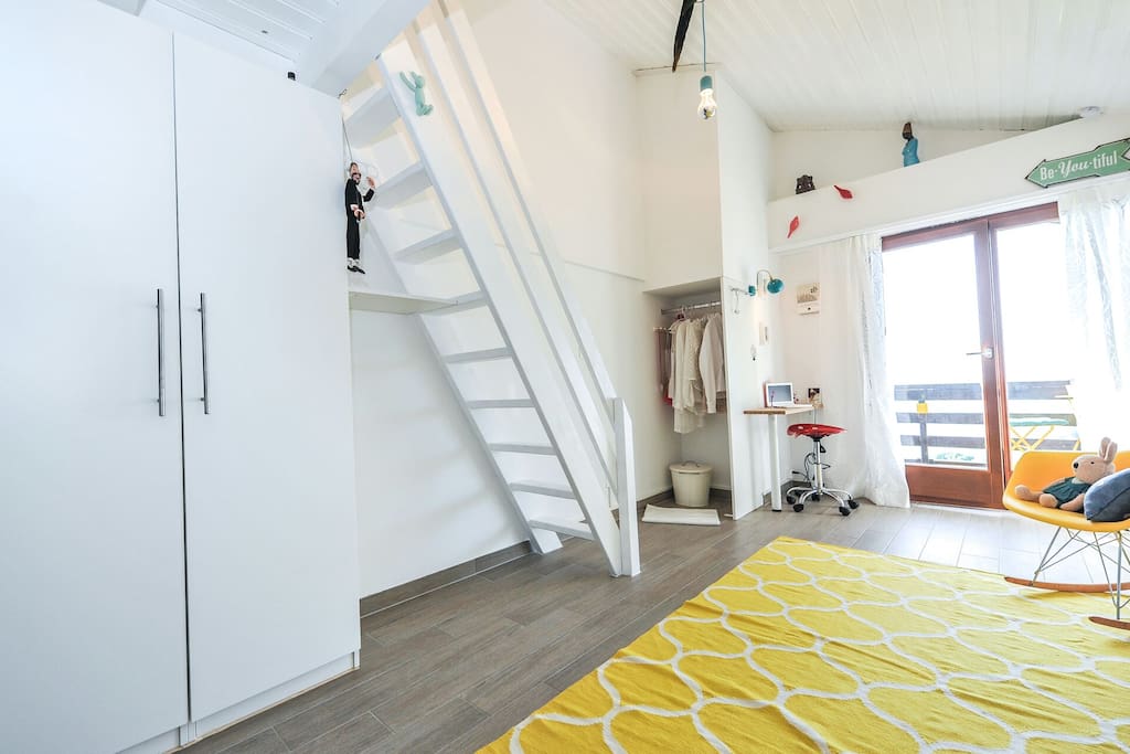 Lounge and stairs to mezzanine. .