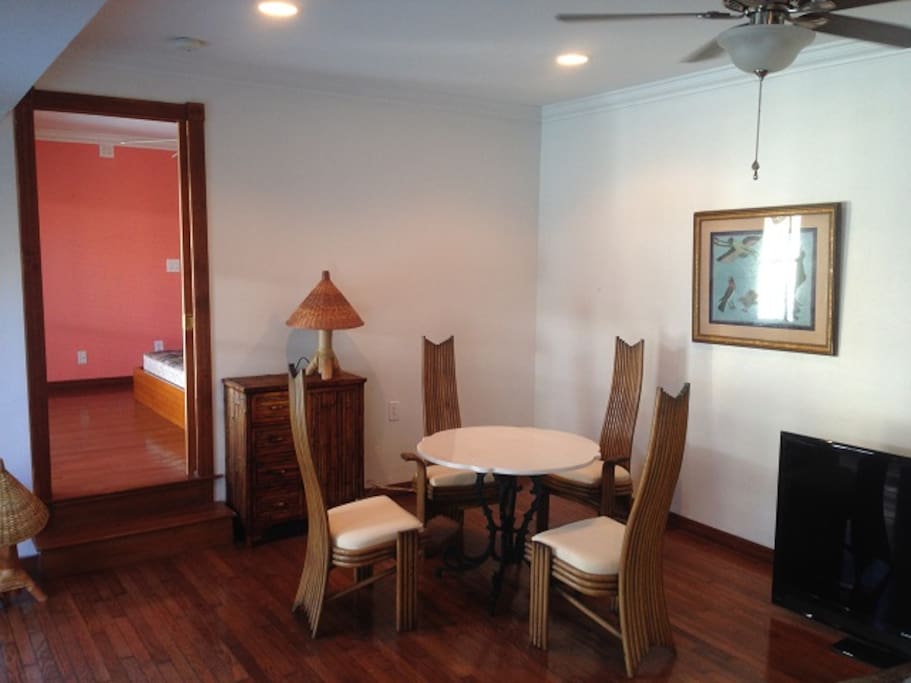 Dining Table with bedroom beyond