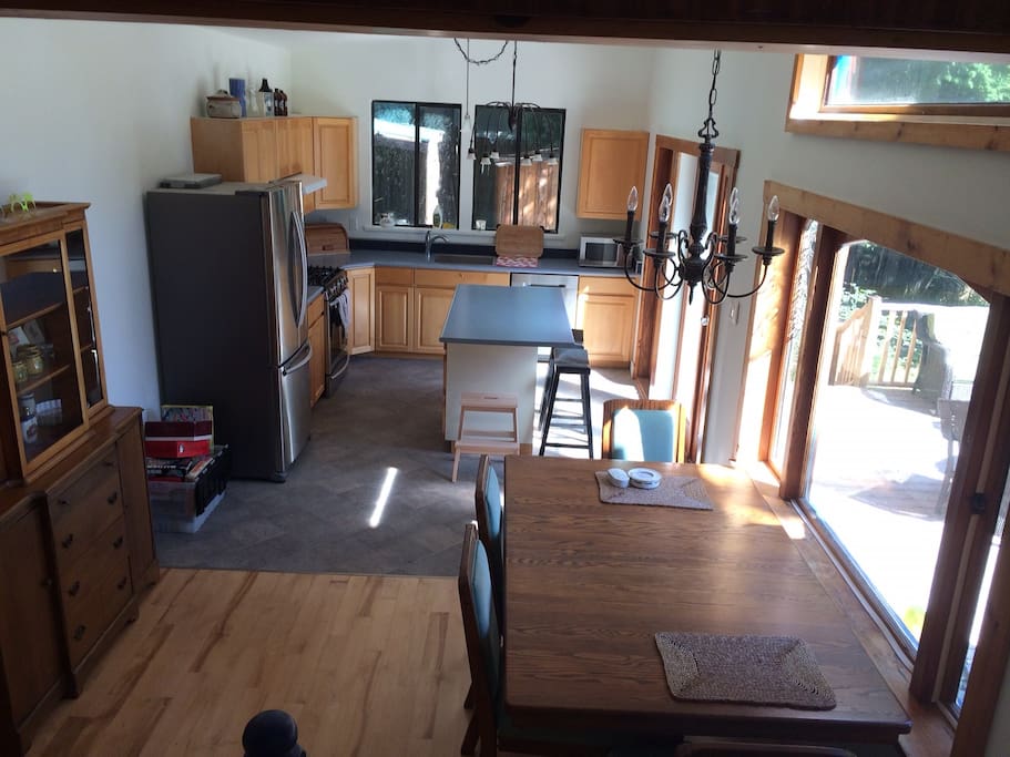 The kitchen has new appliances, including a gas range, and a large BBQ on the deck.