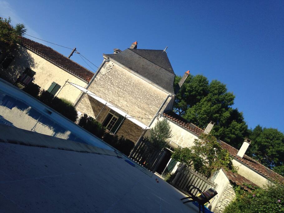 the house from the garden with pool and shaded southfacing veranda