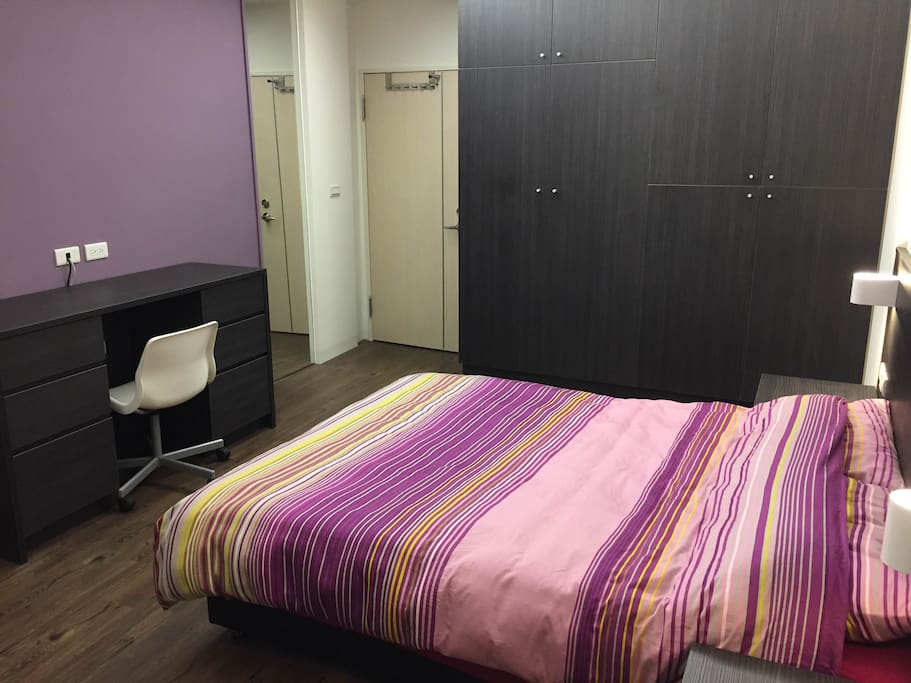 Next to the bed there is a large closet, and two desks for your use