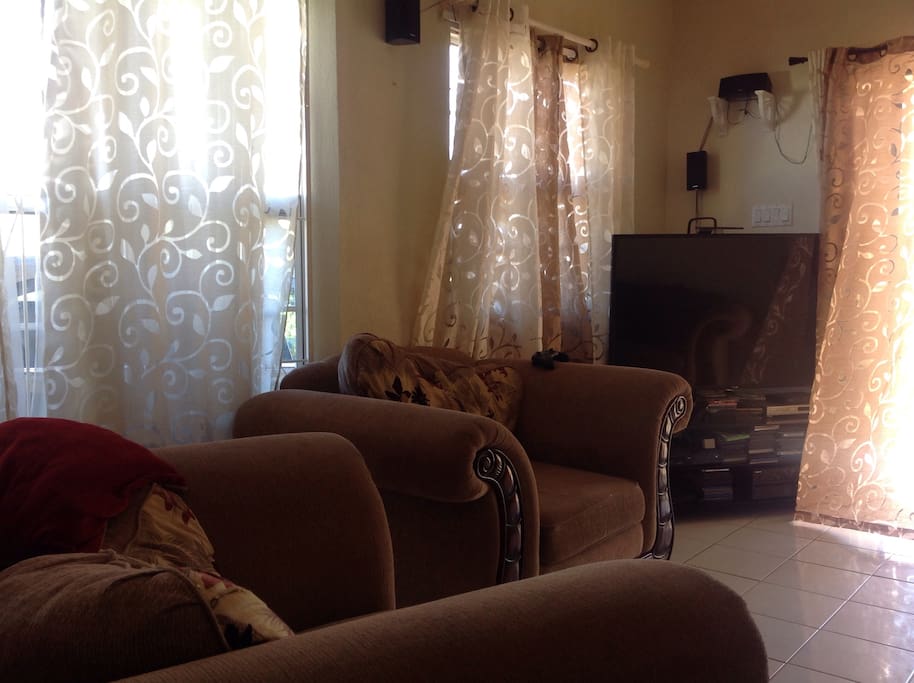 Living Room with large TV and Xbox One