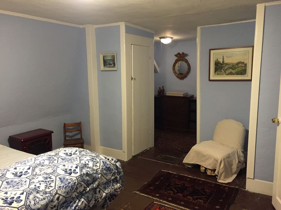 Blue bedroom reading nook. We have a futon that fits in this room-- guests are welcome to it if they do not wish to share a bed.