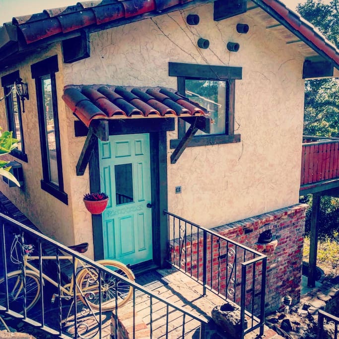 front of cottage entrance to living area and kitchen