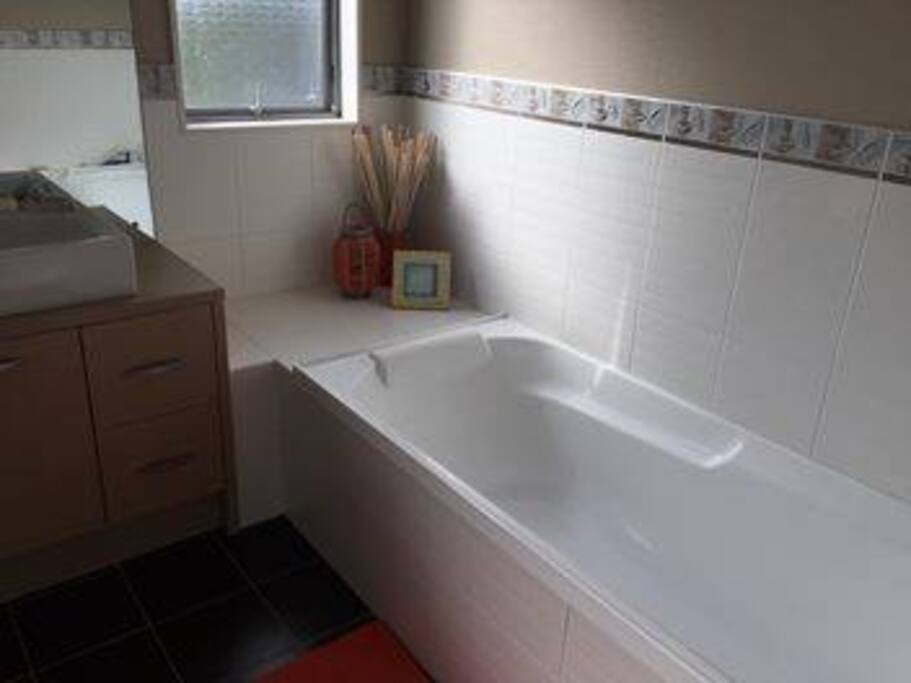 Bathroom with bath and shower