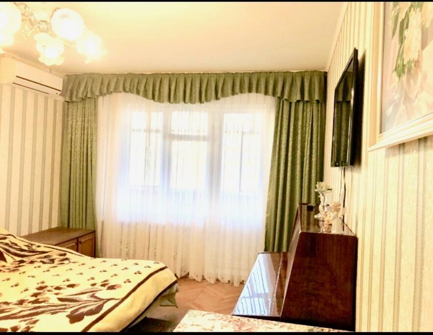 Bedroom 1 (another view with flat screen TV and balcony)