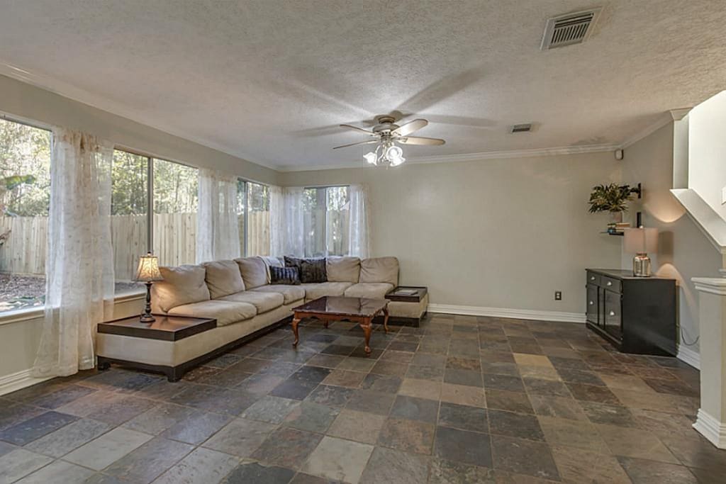 Big windows in the living room facing the beautiful backyard