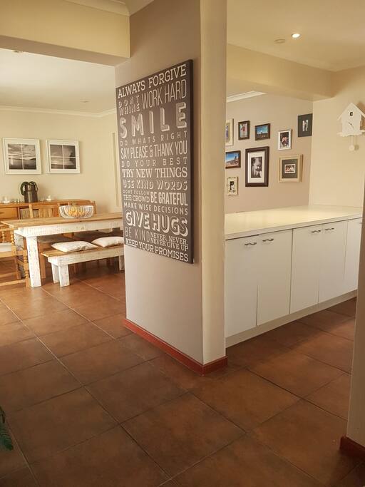 front door entrance with dining room ahead, left to living room and right into kitchen