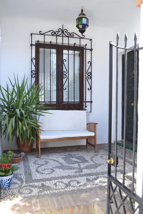 Front patio provides shade, privacy and security