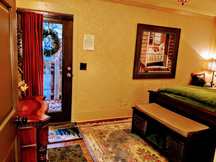 First bedroom has bird themed decor and luxurious Queen bed.