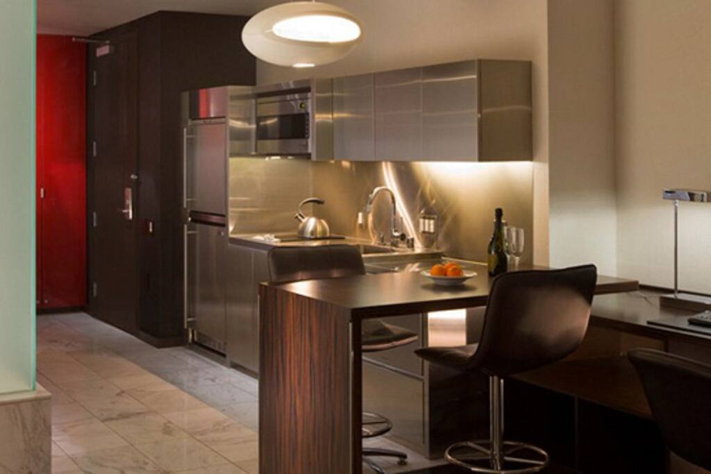 Perfect Sized- Fully Stocked Kitchen with Fridge, Stove, Dishwasher, table and chairs. Marble Floors