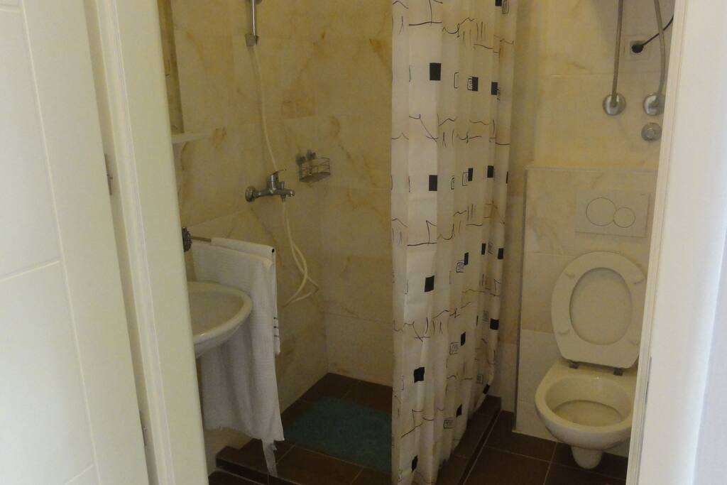 Spacious bathroom with floor heating .