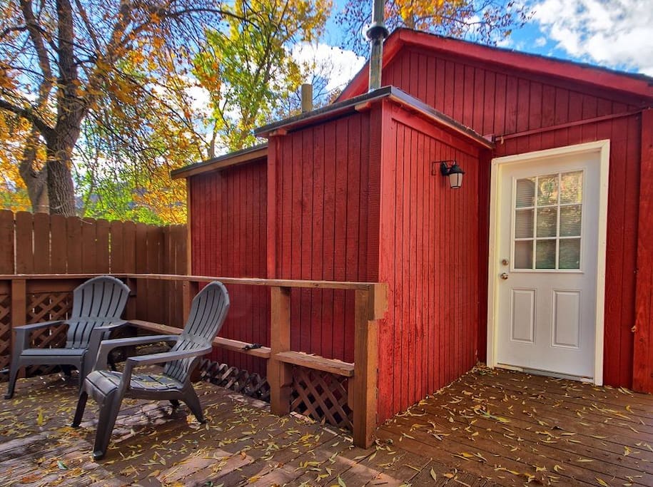 Nestled in the shade of tall trees, this cabin boasts comfort and a welcoming feel!