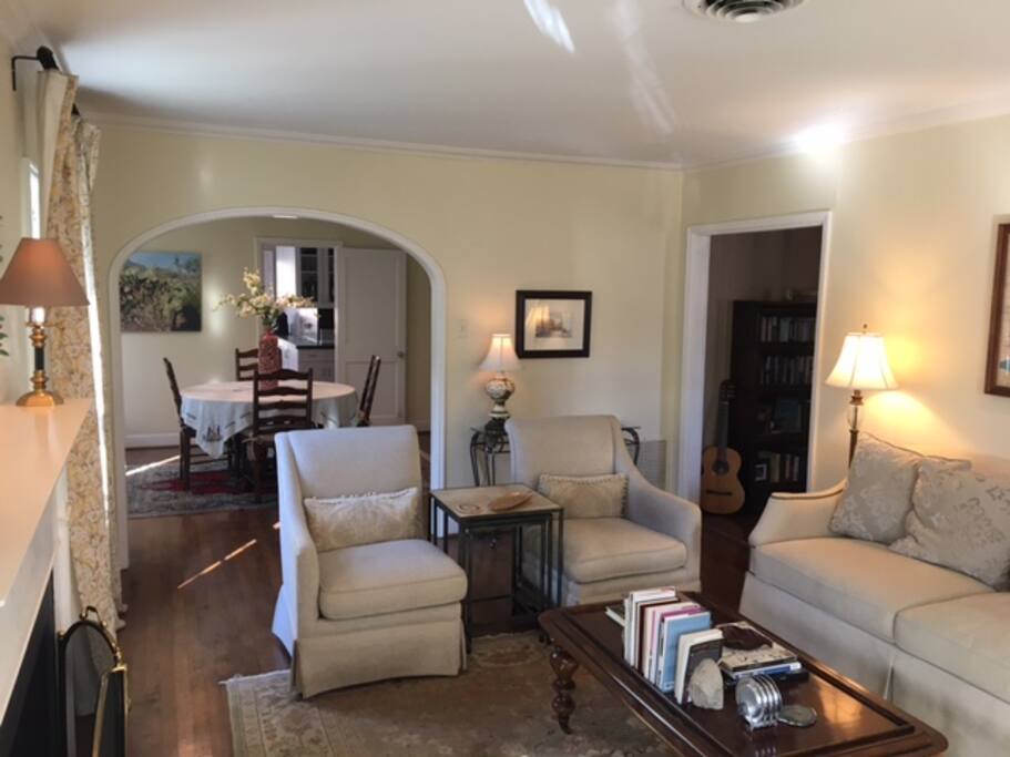 Gracious formal living room with working gas fireplace, tasteful furnishings, and architectural detail.