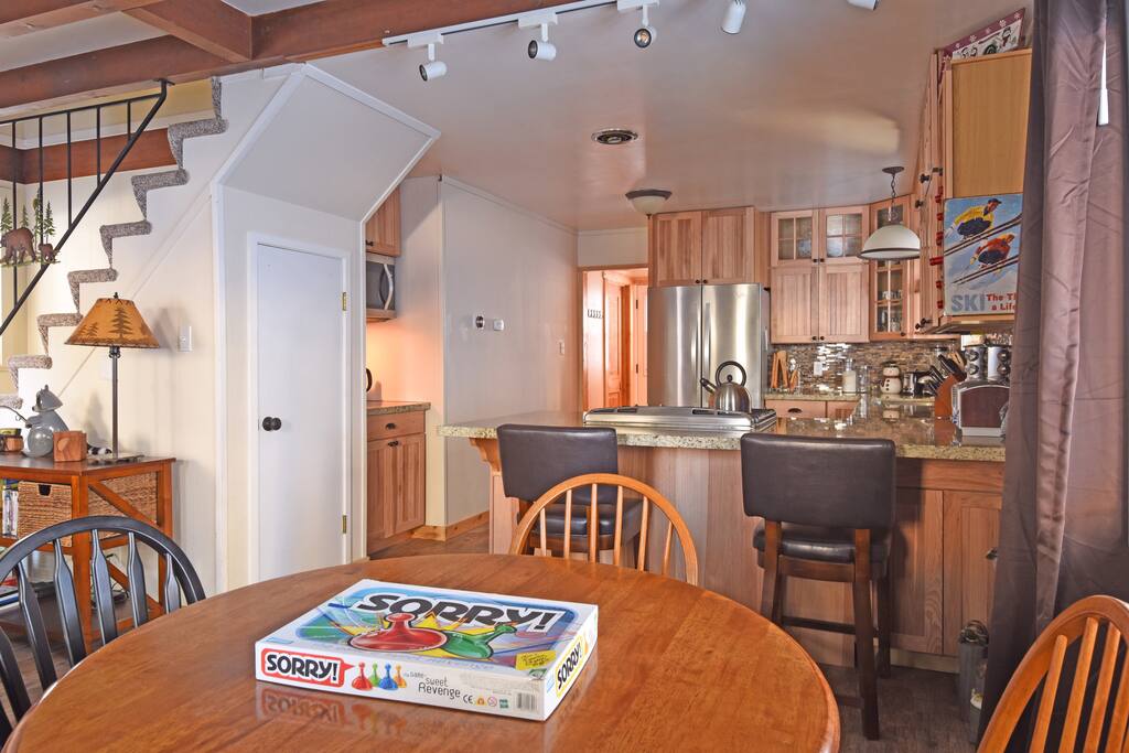 The dining table and counter provide seating for six