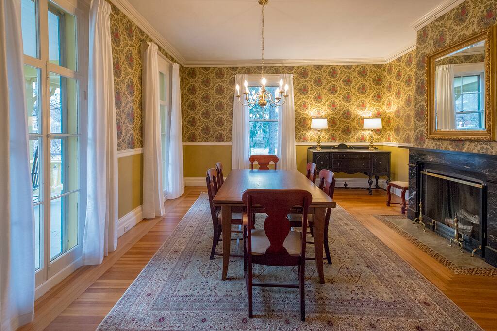 The dinning room with Italian marble fireplace and floor to ceiling windows.