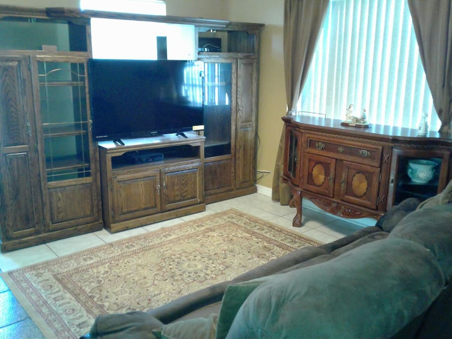 This is a shared living room with a 50 inch color tv, Wi-Fi and 2 recliners to just relax.