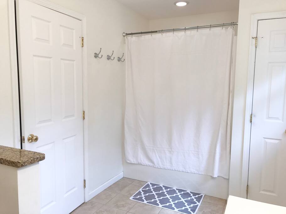 Master bath. Toilet, two sinks, and a shower with bathtub.