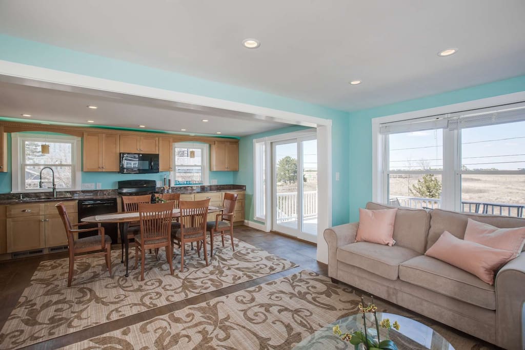 Gather around the open living space surrounded by those never-ending views