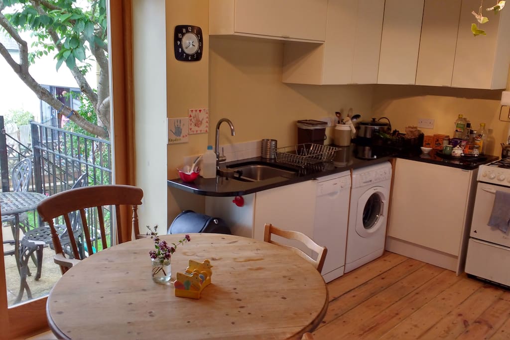 Kitchen, washing machine, dishwasher, table and 4 chairs.