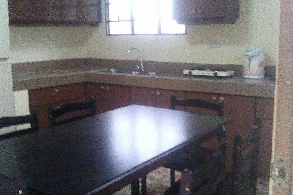 Dining/Kitchen with electric burner and refrigerator
