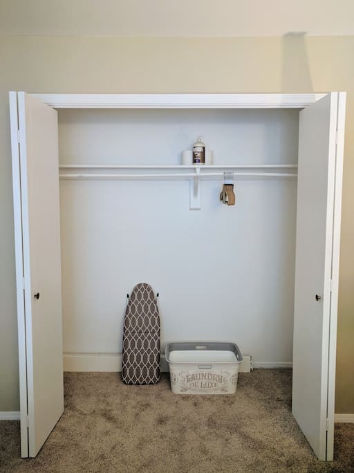 Full size closet with ironing board and laundry basket. Extra pillows and blanket are available