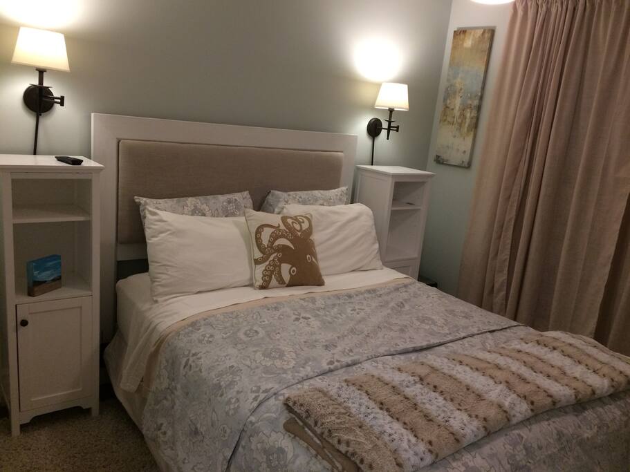 Comfy linens and TV in Master.