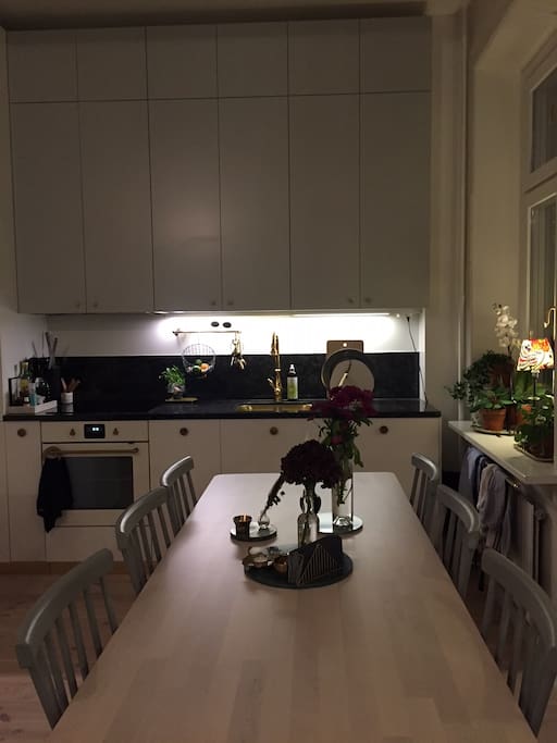 Large dinner table with 6 chairs but room for 8 persons