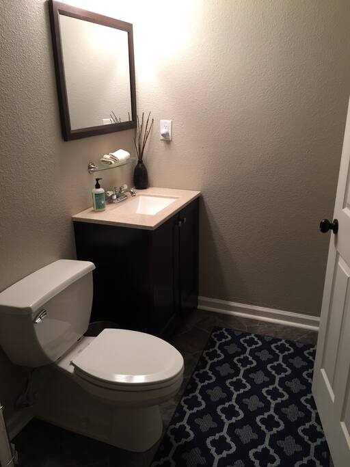 This is a half bath, attached to the bedroom. We stock a hair dryer, curling iron and various toiletries.