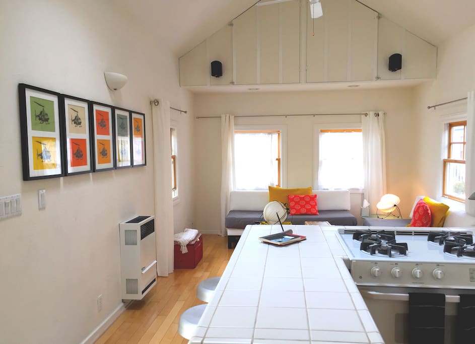The living room has 2 daybeds, each with a twin mattress.