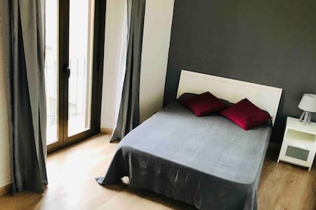 Sunny room next to the beach and train station