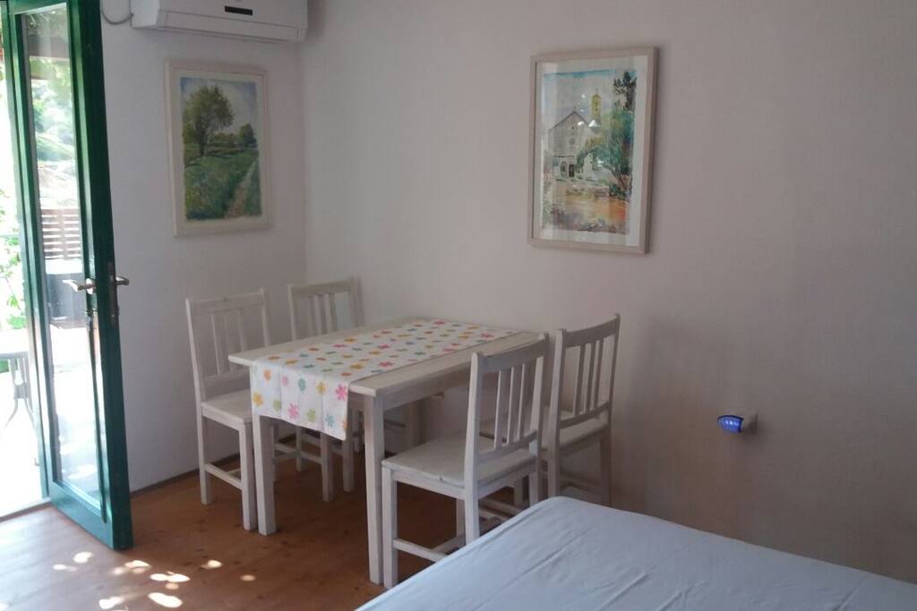 Bedroom 1 is connected to the front terrace with french doors.