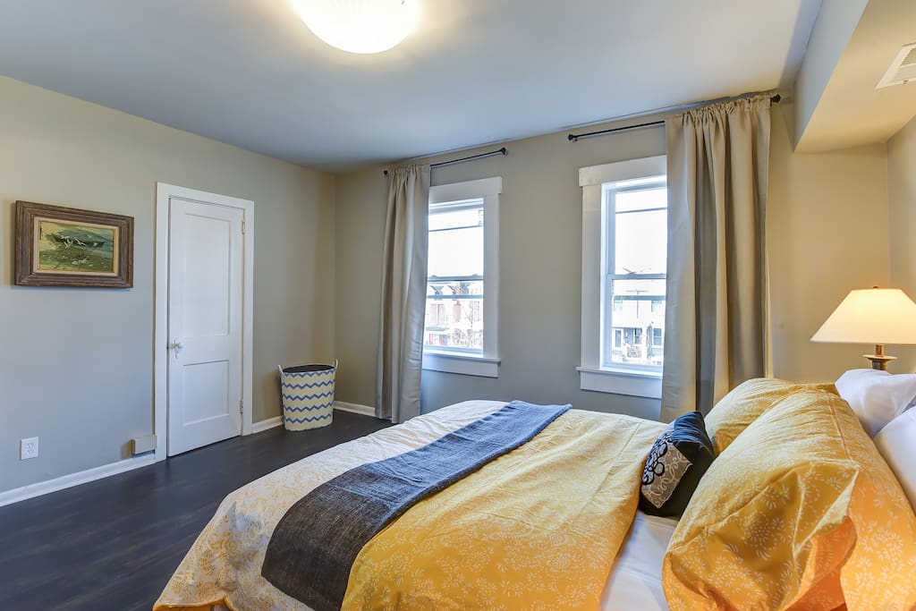 The large master bedroom is equipped with a comfy queen size bed.