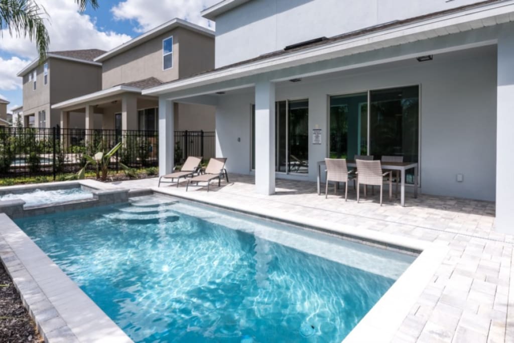 Covered lanai, outdoor dining area, private swimming pool and a spillover tub