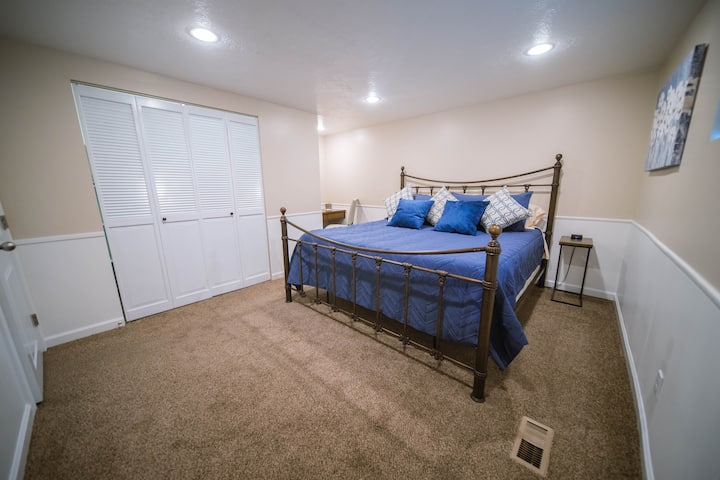 Bedroom with king size bed, large closet and desk area