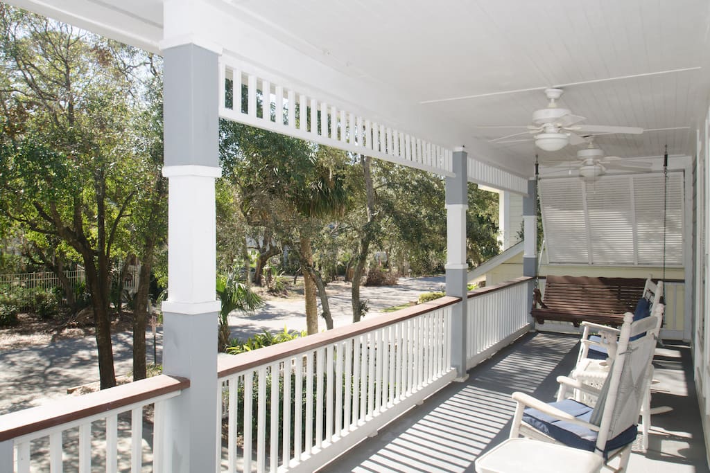 The covered porch with rocking chairs awaits you.