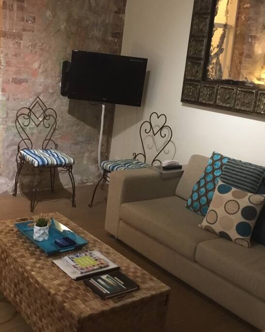 Living area next to dining and kitchen.