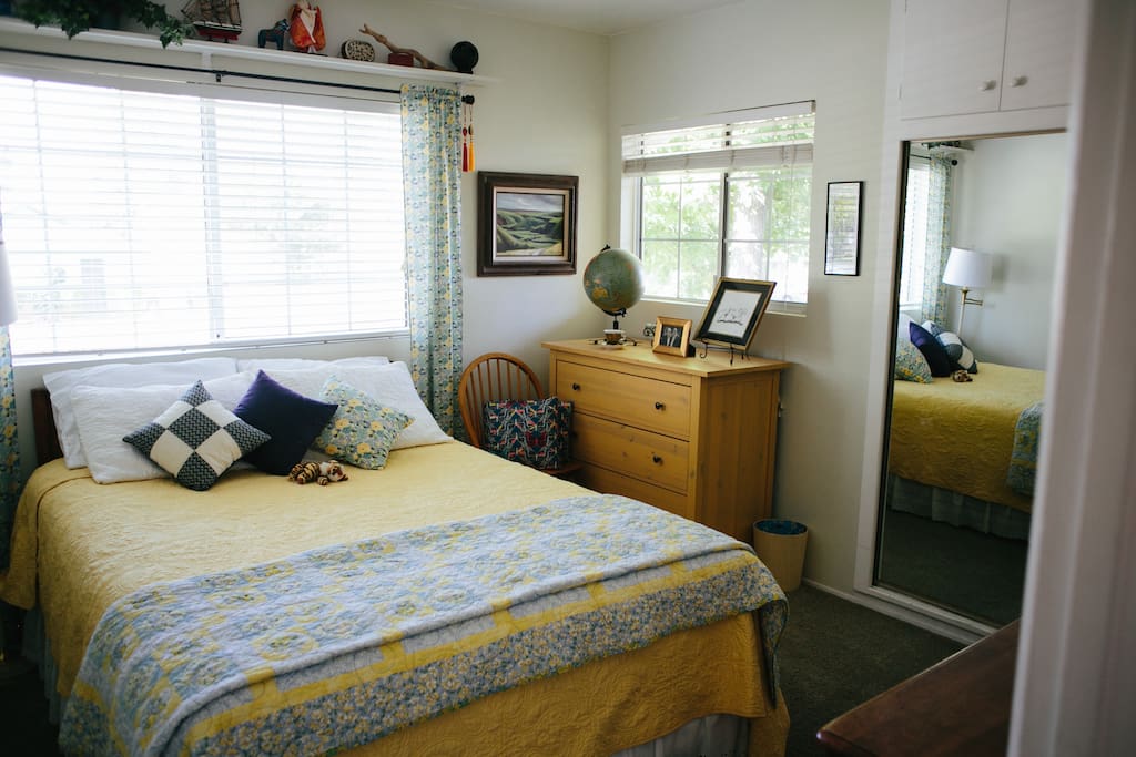ground floor "tiger room" (see the tiger with the pillows?) with mirrored closet and dresser drawers.