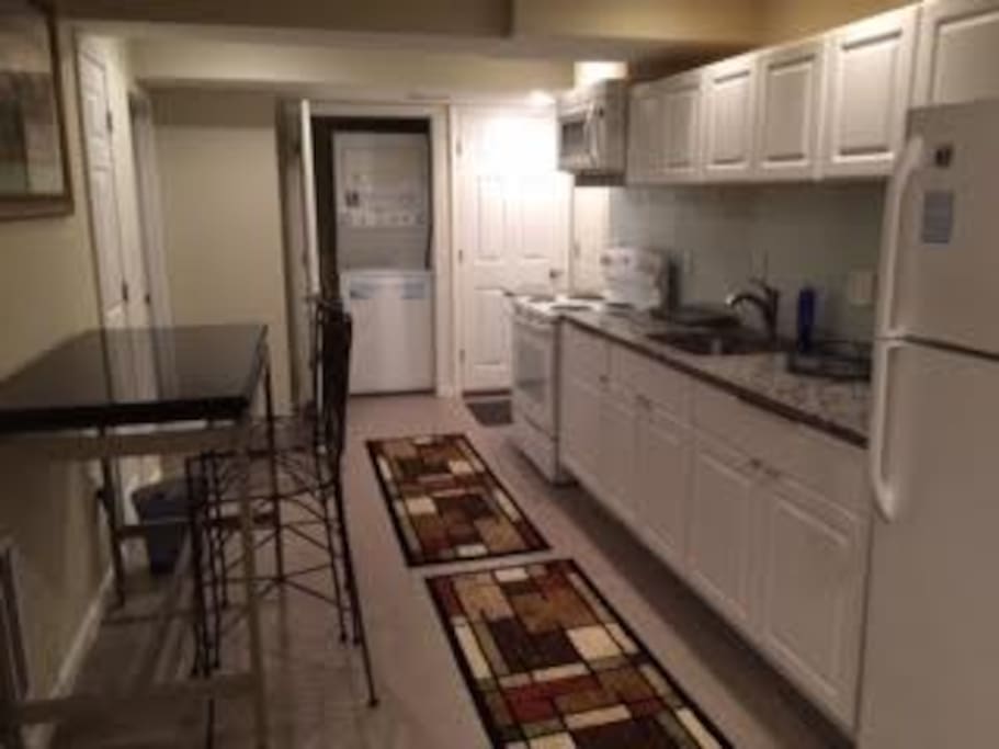 Galley kitchen cooking utensils and coffee maker